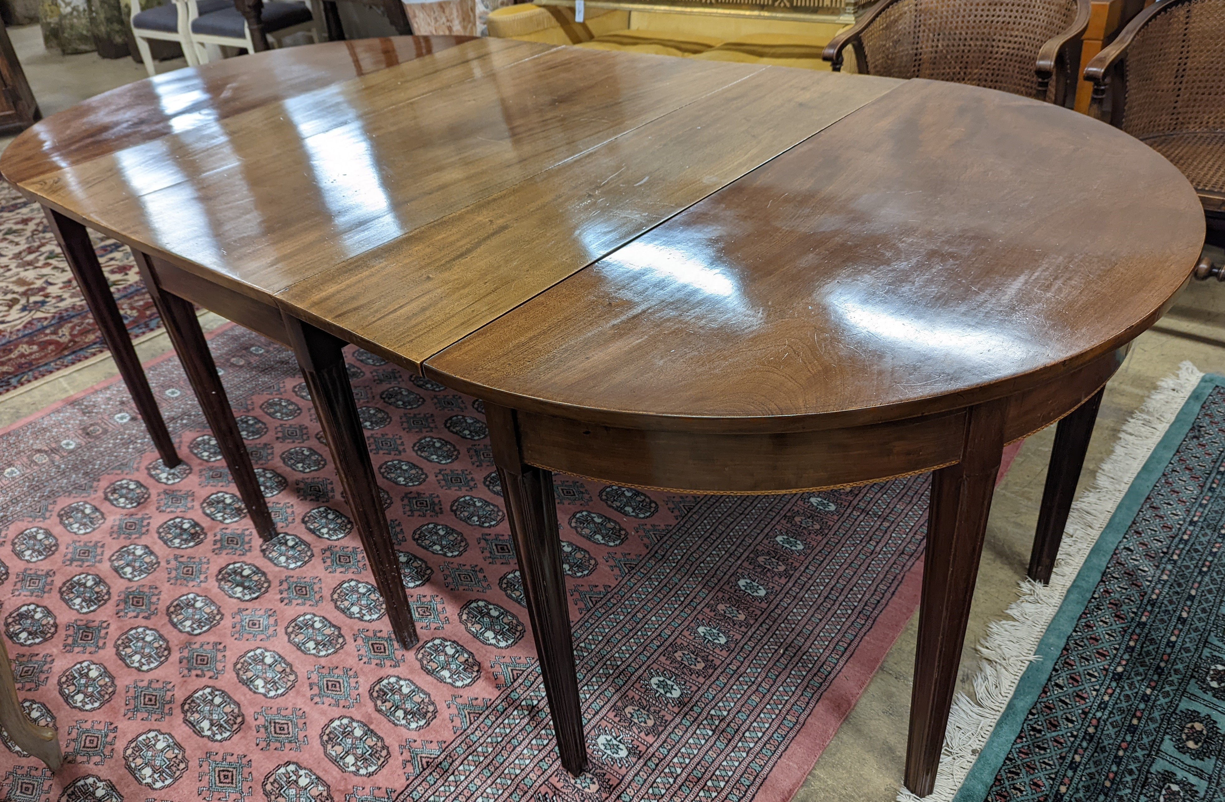 A George III mahogany D end extending dining table, with drop flap central section, length 240cm extended, width 120cm, height 76cm